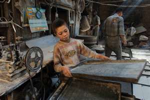 Young Boy in a Factory